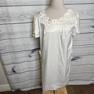 Silky cream sheath dress with pockets, floral appliqués